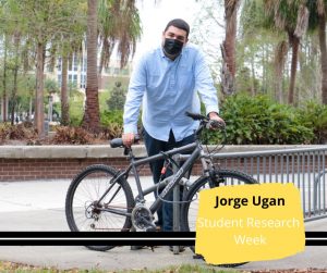 Jorge Ugan behind a bicycle