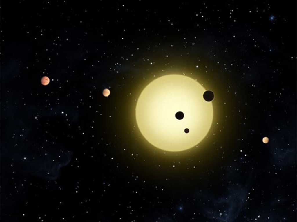 An artist’s representation of Kepler-11, a small, cool star around which six planets orbit.